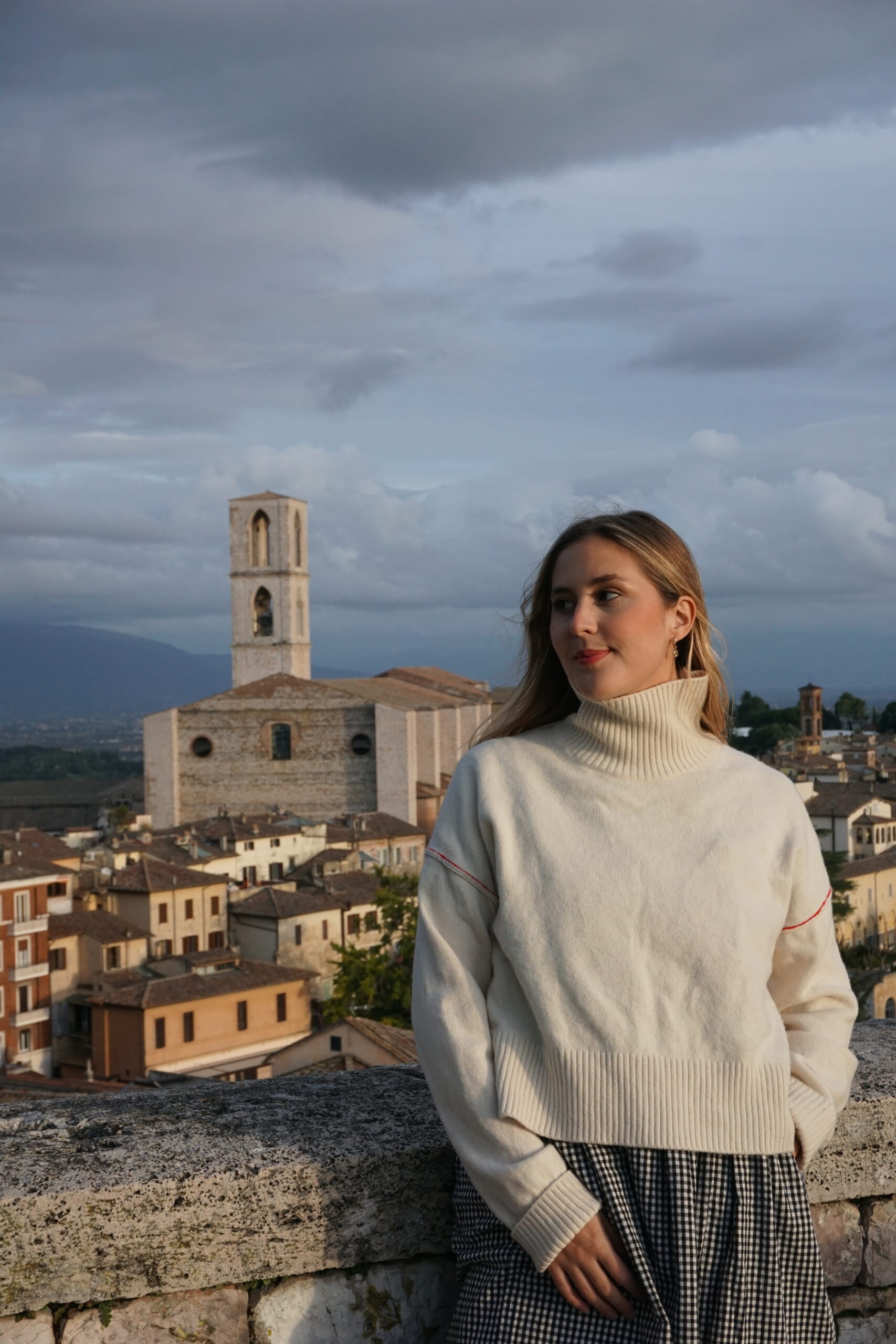 Sabrina in the foreground with a view of Umbria behind her