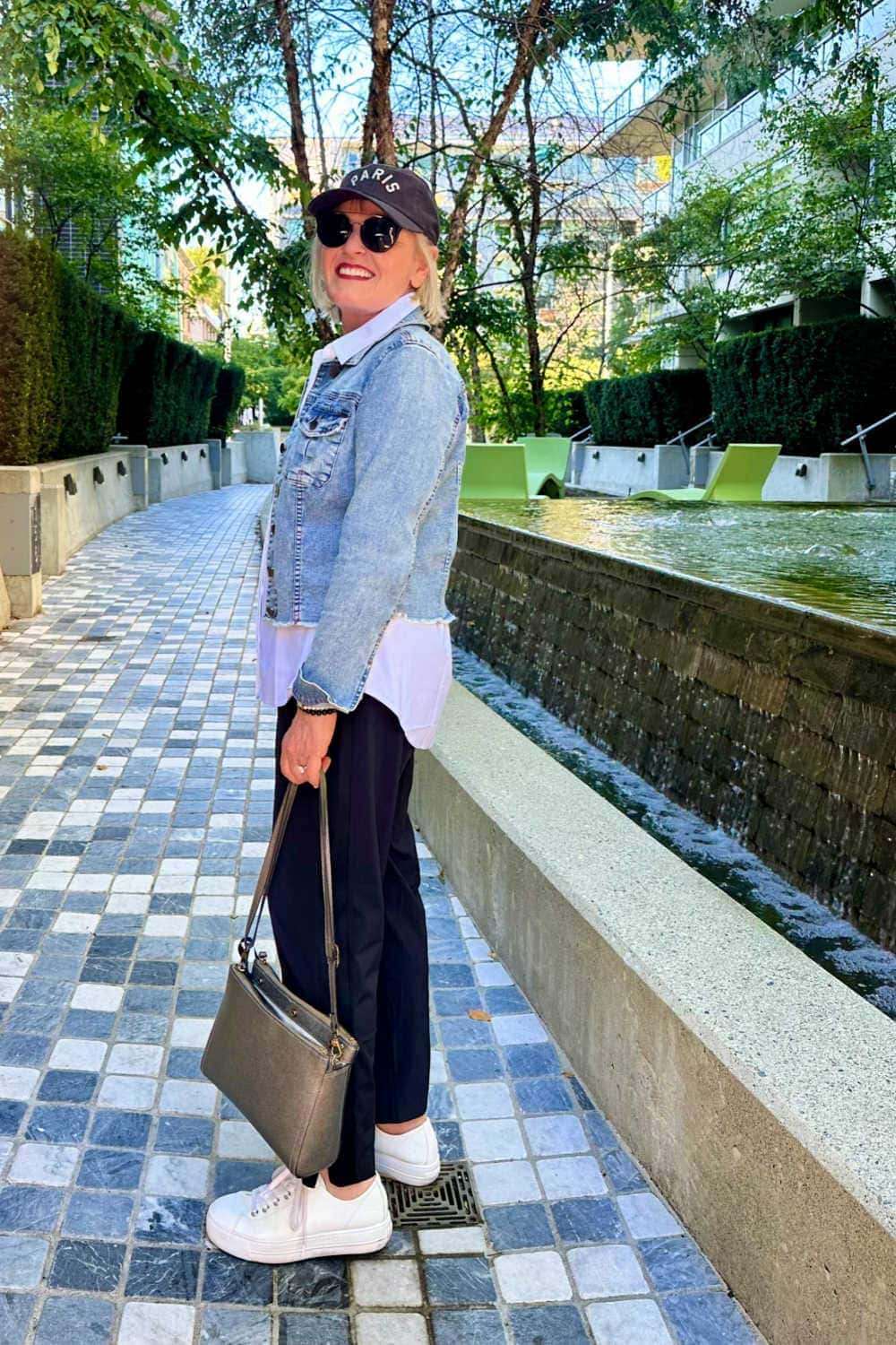 older woman wear casual travel outfit with travel purse and
supportive sneakers