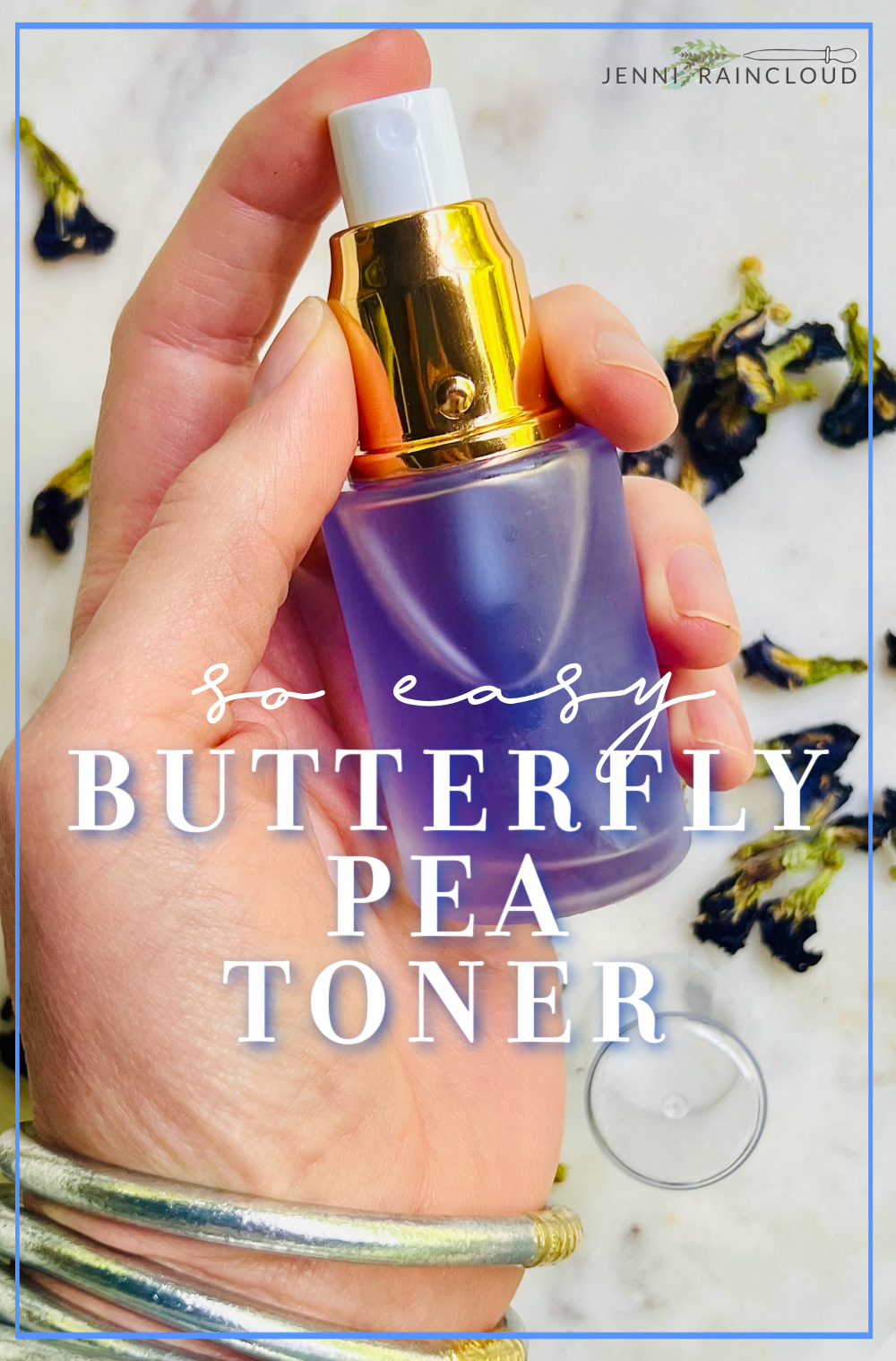 hand holding glass bottle of butterfly pea toner.