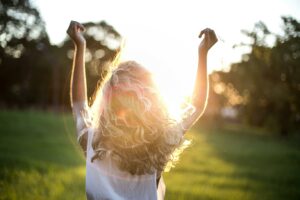 Woman running in the sunlight