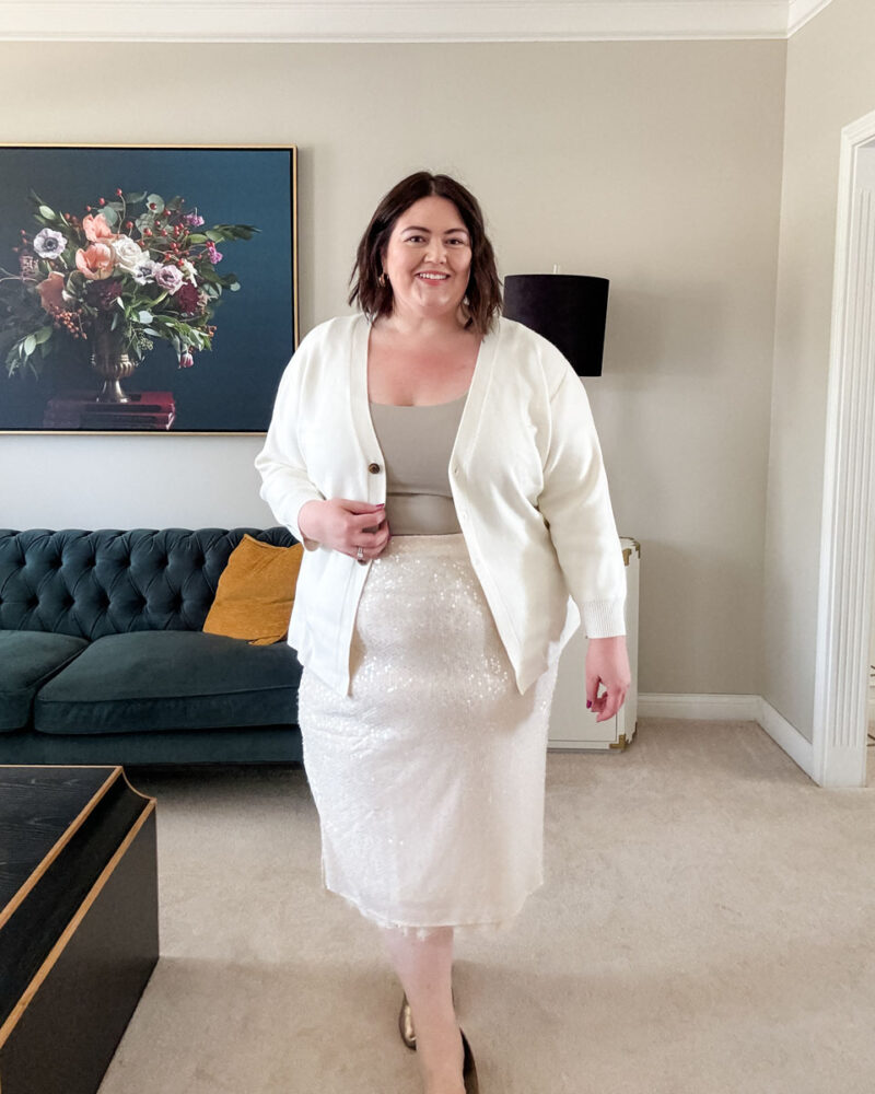 Plus size fall outfit from Target with champagne sequin skirt, nipped waist cardigan, and seamless tank top.